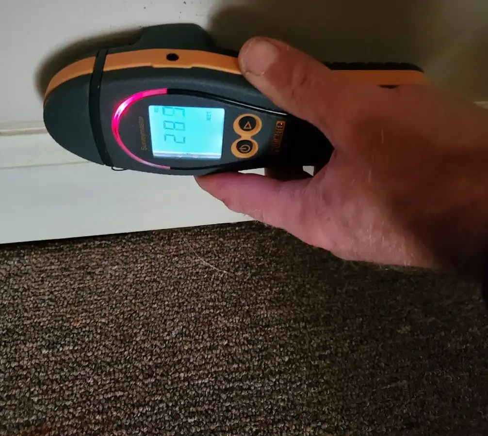 Moisture detection at baseboard during Storm Damage Restoration in North Tonawanda